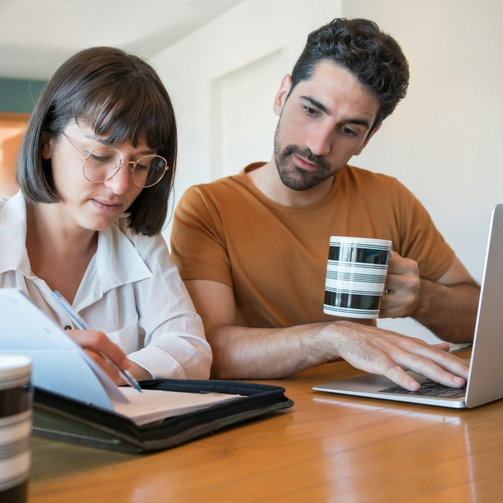 young-couple-paying-bills-on-laptop-medcertify